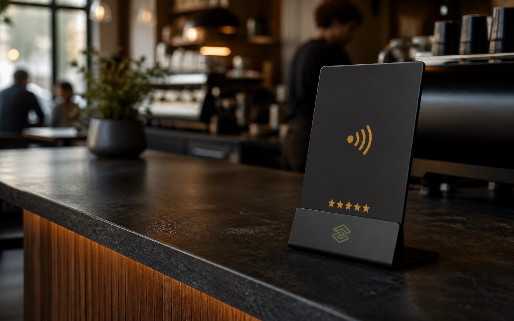 A premium matte-black NFC review stand on the counter of an independent café